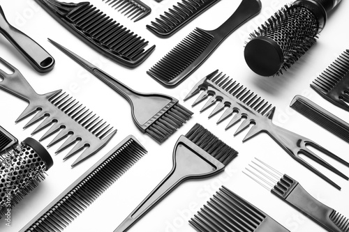 Composition with hair combs and brushes on white background