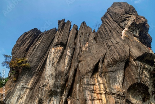 .The huge rock is composed of solid black, crystalline karst limestone in a tourist place Yana Rocks this is an old stone formation with caves inside. Karnataka. India. Indian tourism concept photo