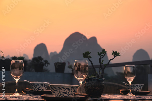 outdoor rooftop dinner set in the dusk