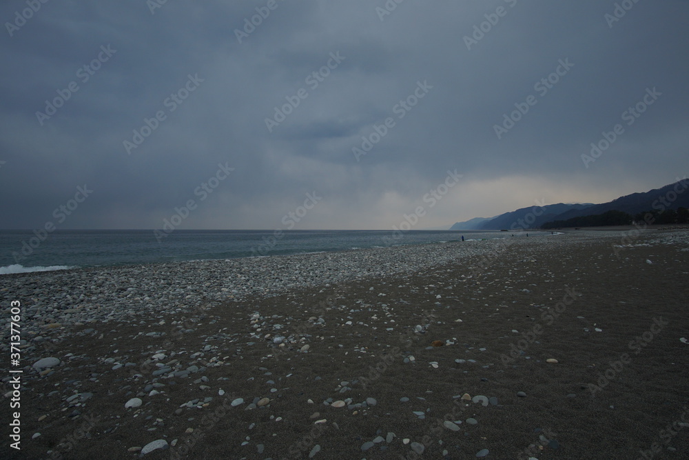 Overcast sky with dark cloud and sea in windy day.