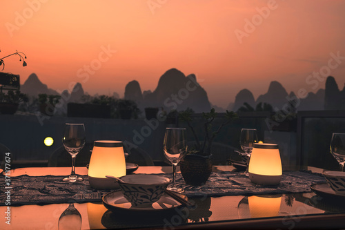 outdoor rooftop dinner set in the dusk