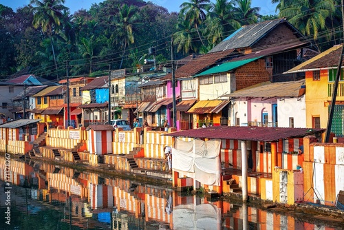 27.12.2019 Gokarna, Karnataka, Colorful indian houses, bright orange-striped temple tank on the bank of sacred lake Koti Teertha. The city is a holy pilgrimage site for Hinduists photo