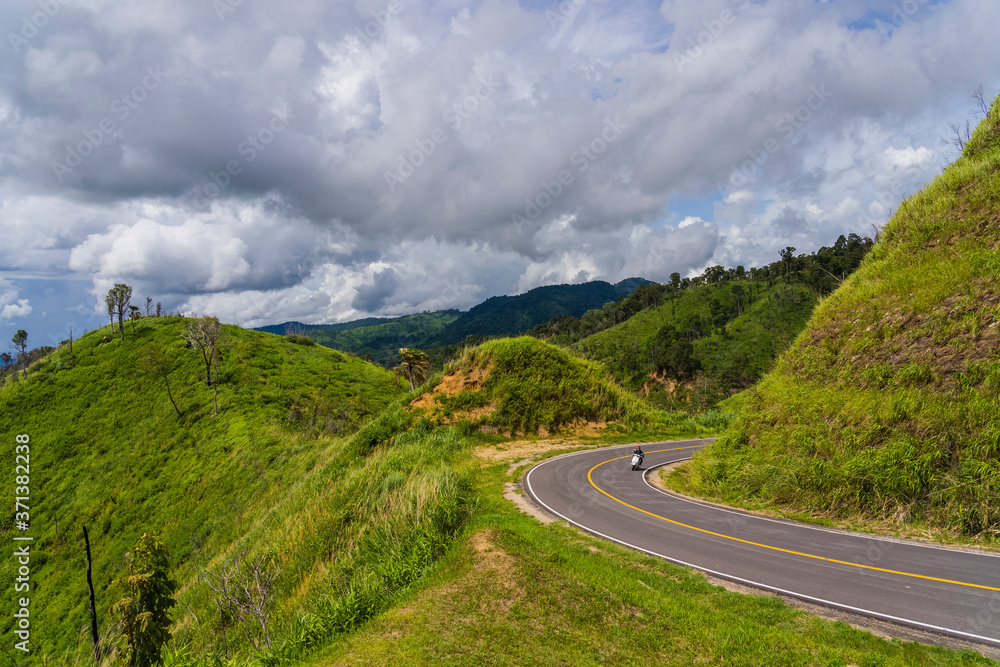 Motorcycle drive riding in mountain road Motorcycle drive riding in mountain road
