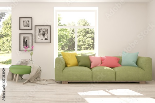 White stylish minimalist room with sofa and summer landscape in window. Scandinavian interior design. 3D illustration