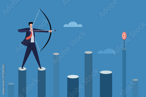 Businessman standing on high pillars aiming target with bow and arrow