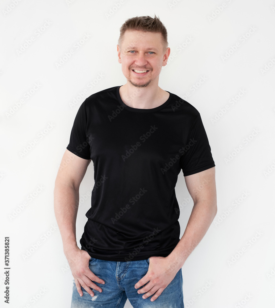 Attractive young man in a black T-shirt. Blank for your design Attractive young man in a black T-shirt. Blank for your design