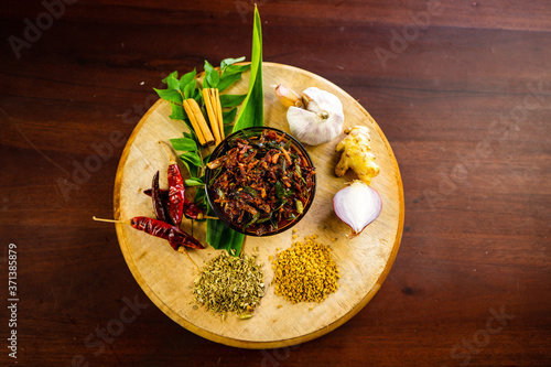 Spicy Maldives fish dish - (dried fish sambol/sambal) with leafy green water spinach (Kankun )stir fries. Asian food kitchen. photo