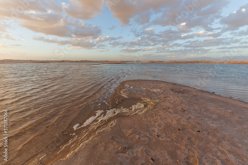 Sunset landscape of salt lakes Ala Shan Desert or Tengger Desert, Inner Mongolia, Northwest of China photo