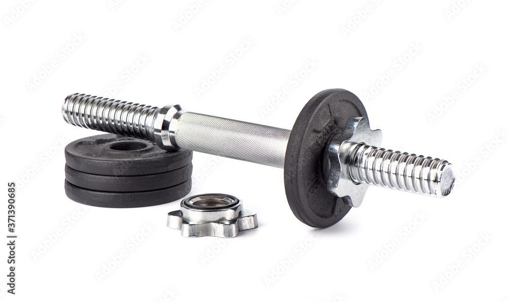 Fototapeta premium Disassembled dumbbell on discs over white background.