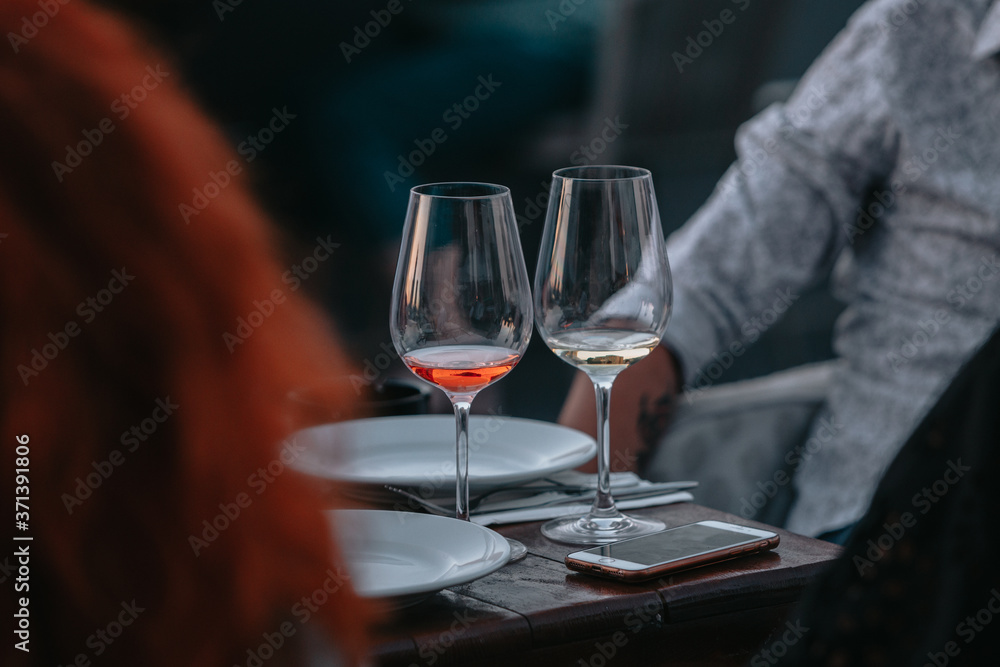Glass of white sparkling wine at a summer tasting in the hand of a model. Glass of white sparkling wine at a summer tasting in the hand of a model.