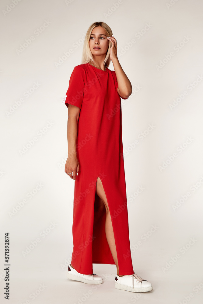 Beautiful young sexy woman with long hair blond perfect skinny tanned body makeup wearing casual red dress collection catalog style fashion accessories store sale businesswoman date party studio. Beautiful young sexy woman with long hair blond perfect skinny tanned body makeup wearing casual red dress collection catalog style fashion accessories store sale businesswoman date party studio.