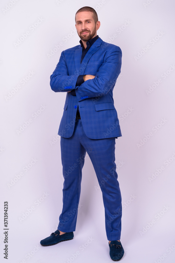 Portrait of handsome bald bearded businessman in suit Portrait of handsome bald bearded businessman in suit