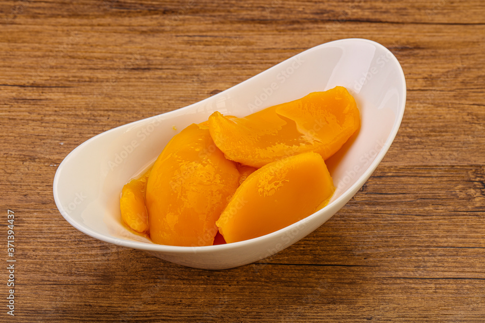 Sweet mango slices in syrop Sweet mango slices in syrop