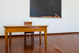 The materials for math lesson stand on the chalkboard in a classroom.
