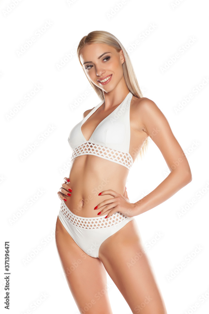 Young hot woman in white bikini, isolated. Young hot woman in white bikini, isolated.