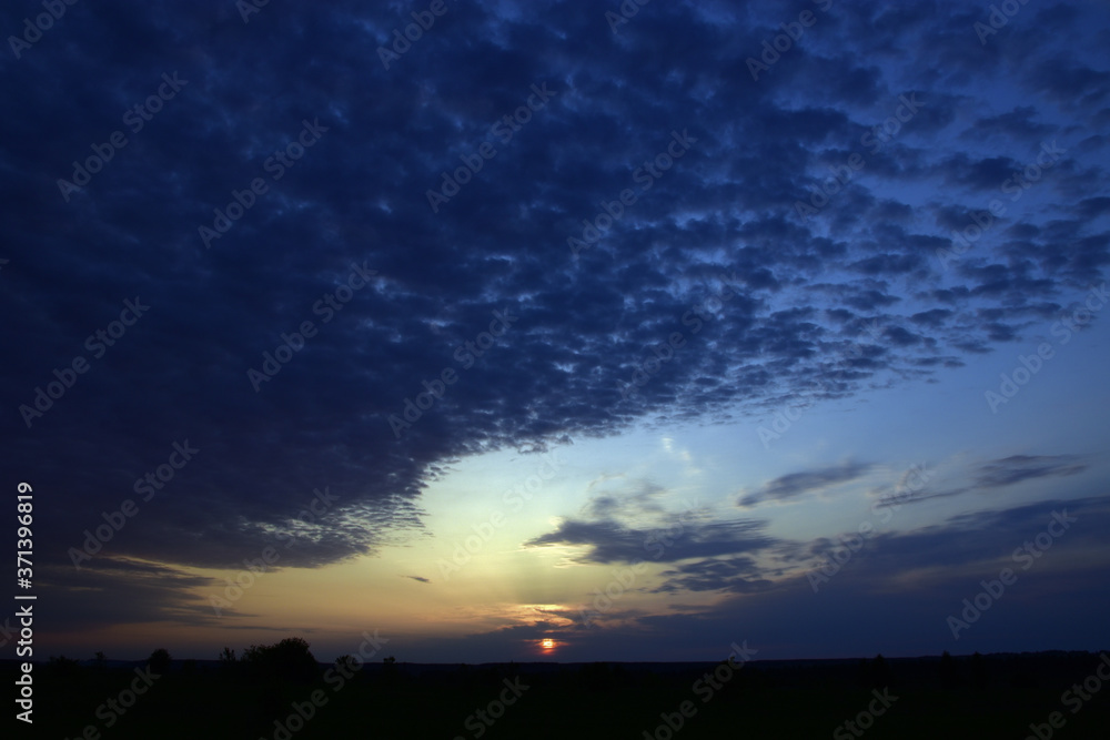 The sun at sunset. Spring in the foothills of the Western Urals.