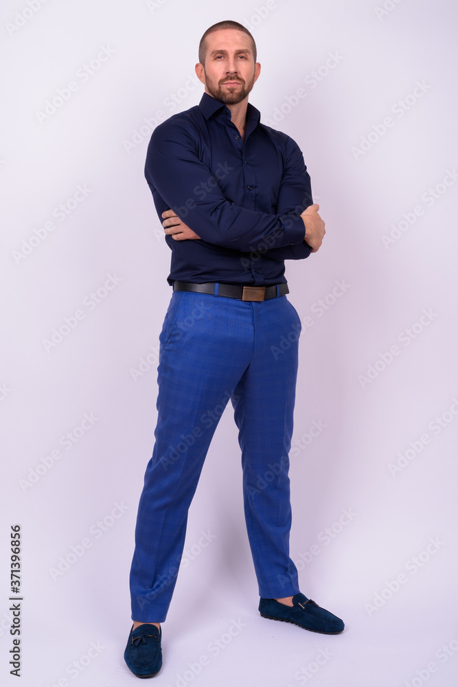 Full body shot of handsome bald bearded businessman Full body shot of handsome bald bearded businessman