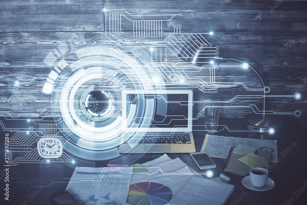 Double exposure of laptop computer and technology theme hologram. Concept of freelance work. Double exposure of laptop computer and technology theme hologram. Concept of freelance work.