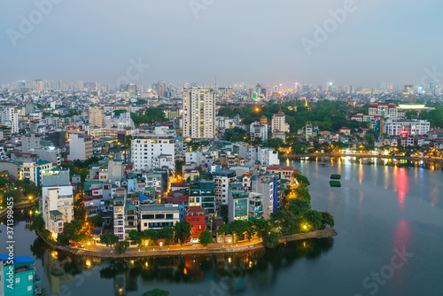 Hanoi cityscape with skyline view during sunset period at West Lake   Ho Tay   in 2020