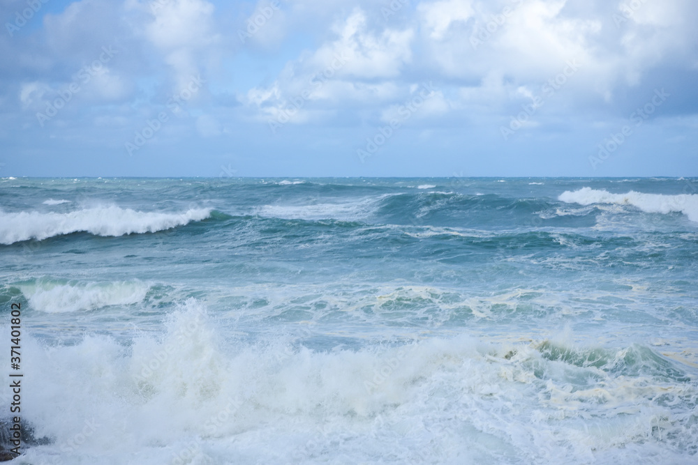 Foamy stong waves crashing in the ocean