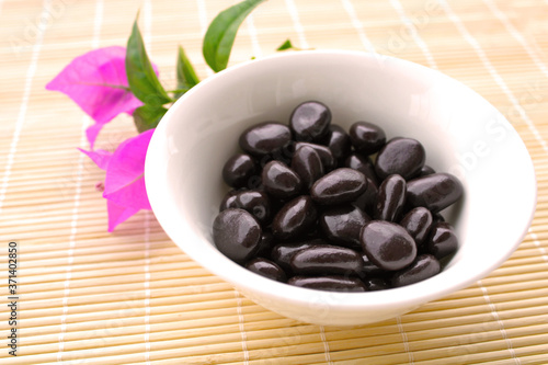 dark chocolate covered raisin beans in the bowl