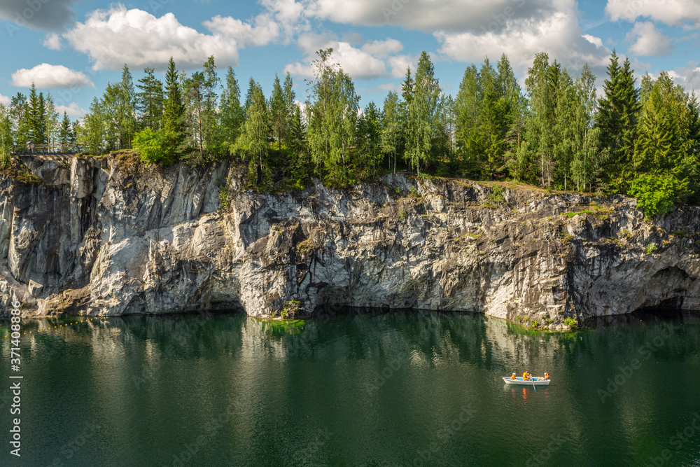 Fototapeta premium Scenic lake in Ruskeala Mountain Park, Karelia. Horizontal image.
