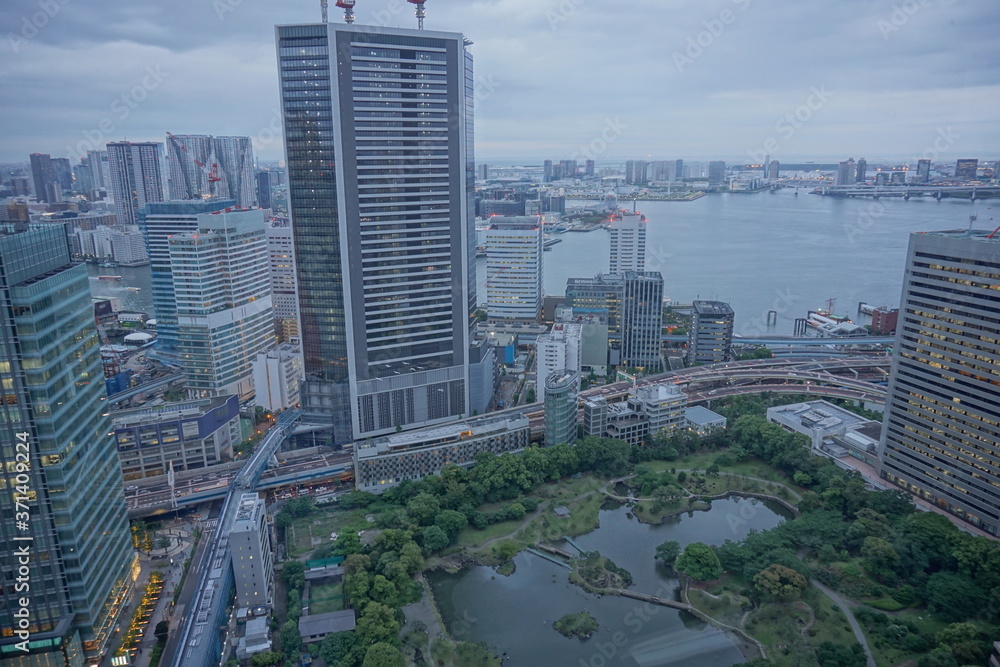 Fototapeta premium urban city skyline aerial view under cloudy sky in Tokyo, Japan