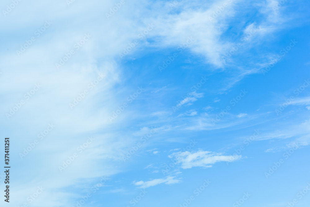 Fototapeta premium Blue sky background with white clouds