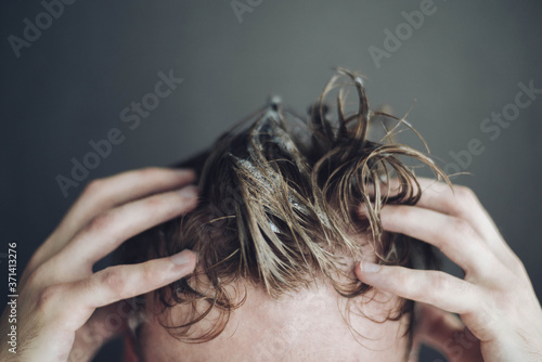 Wallpaper Mural a man washes his hair: hands and wet hair in shampoo foam Torontodigital.ca