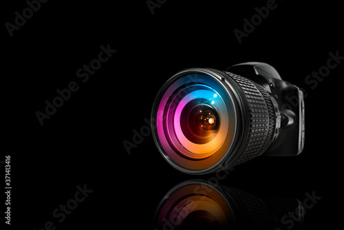 Professional digital camera with lens attached.