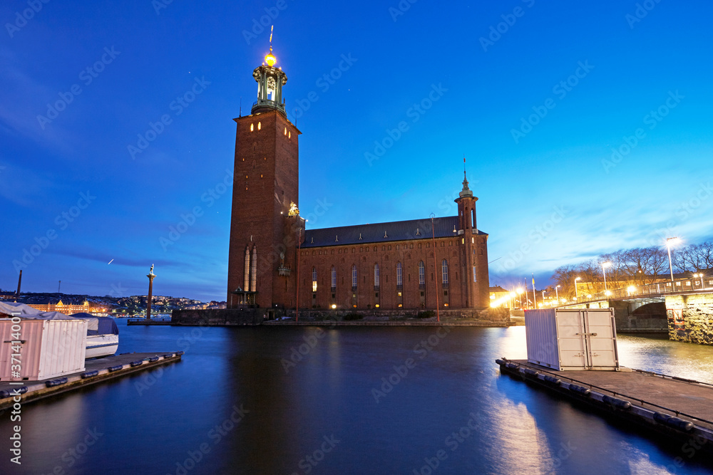 Fototapeta premium Stadshuset City Hall in Stockholm illuminated at dusk