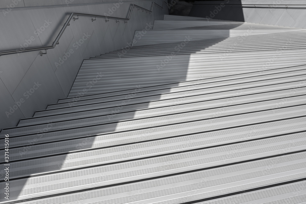 Obraz premium Amazing futuristic architecture - geometric uneven moderb staircase to underground