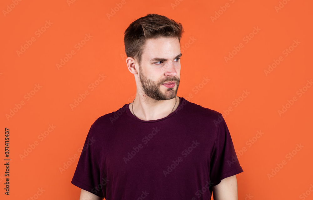 Facial care. sexy man wearing purple clothes posing in studio. Good confident young man standing in urban shirt. denim fashion style. handsome man with beard. young unshaven man Facial care. sexy man wearing purple clothes posing in studio. Good confident young man standing in urban shirt. denim fashion style. handsome man with beard. young unshaven man