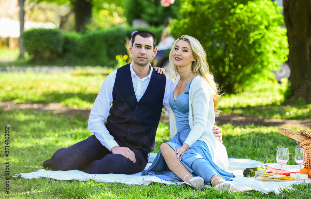 romantic couple on picnic. love date in spring. summer outdoor leisure. time to relax. couple in love. celebrating engagement. happy family in park. food and drink. man and woman romantic couple on picnic. love date in spring. summer outdoor leisure. time to relax. couple in love. celebrating engagement. happy family in park. food and drink. man and woman