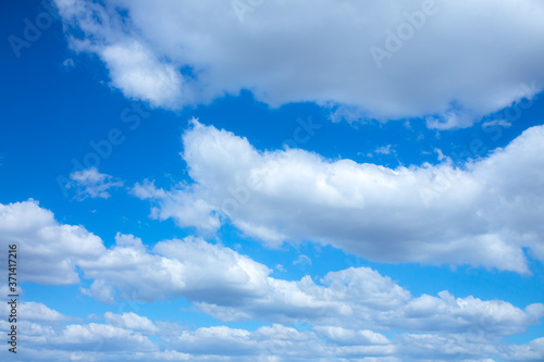 Blue sky and white clouds. Beautiful nature background. Summer vibes.