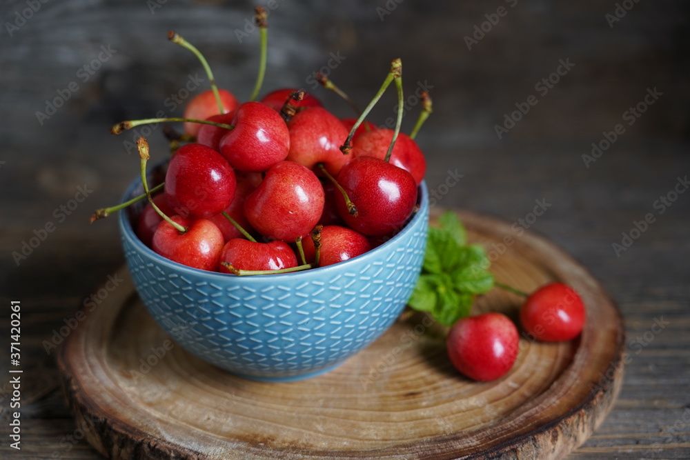 Red sweet cherries. Fruit bird cherry, (Prunus avium) plant species belonging to the rosaceae family Red sweet cherries. Fruit bird cherry, (Prunus avium) plant species belonging to the rosaceae family