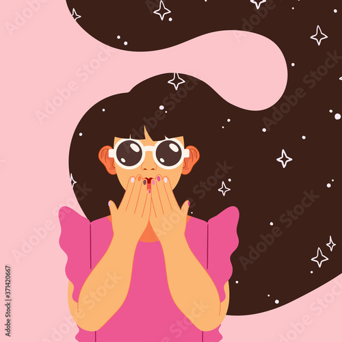Portrait of a little beautiful girl with long brown hair and fashionable sunglasses. The child covers his mouth with both hands in surprise. Template for a holiday postcard, advertising banner.