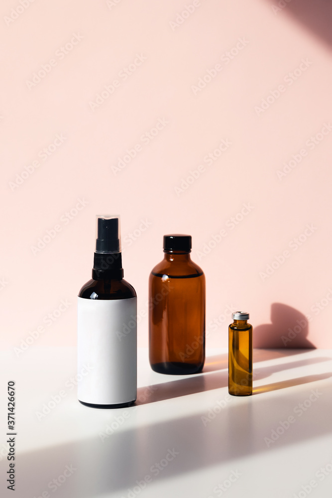 Vertical photos with three bottles, containers for perfume, lotions, and other liquids.