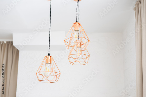 Three chandeliers in the Art Nouveau style of copper wire