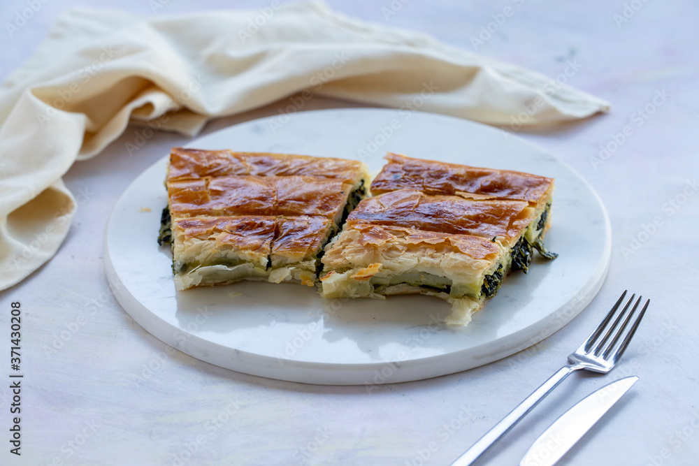 spinach pie on a white background