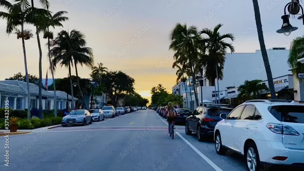Naples downtown 5th ave time-lapse driving down the street with a bike Naples downtown 5th ave time-lapse driving down the street with a bike