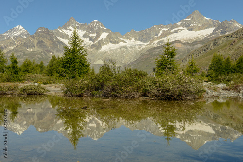 Mountain landscape with a lake over Zermatt in the Swiss alps © fotoember