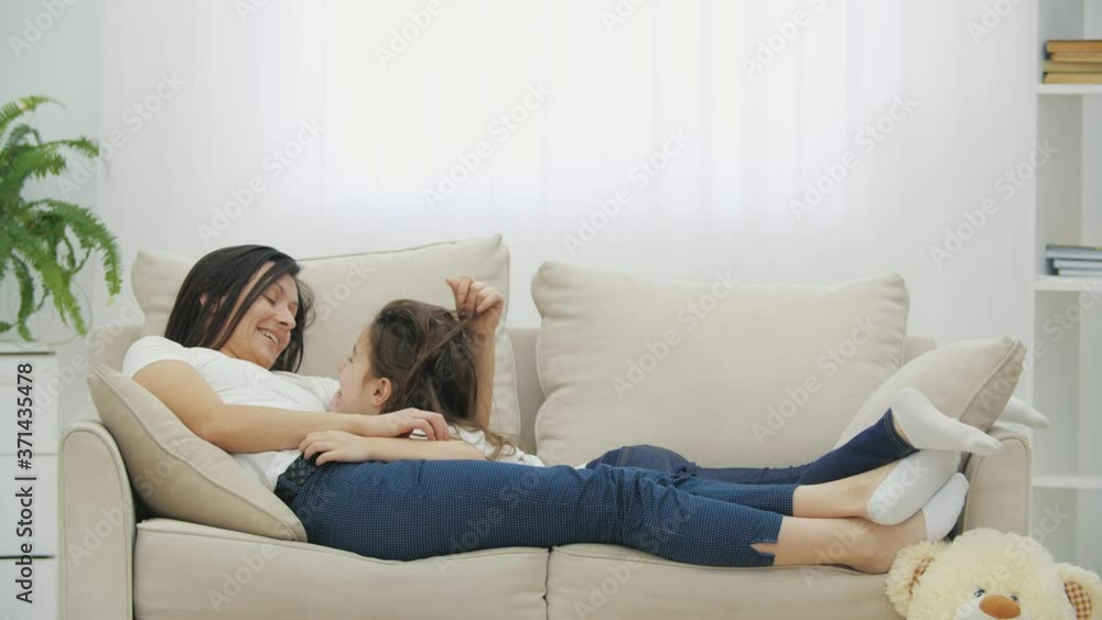 4k video of mother and daughter having conversation at home. 4k video of mother and daughter having conversation at home.