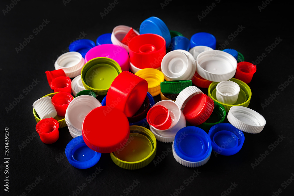 Recycled plastic bottle caps. Colorful caps of plastic bottles on a