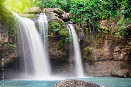 Travel to the beautiful waterfall in deep forest  soft water of the stream in the natural park at Haew Suwat Waterfall at Khao Yai National Park  Thailand