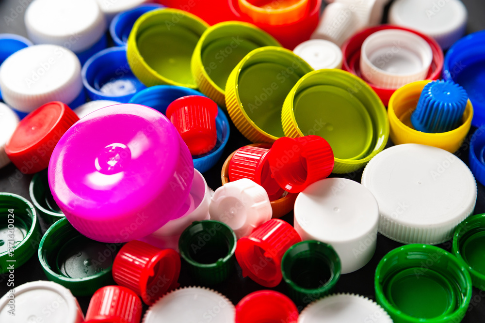Top view of plastic bottle caps. Caps for bottles from recycled plastic