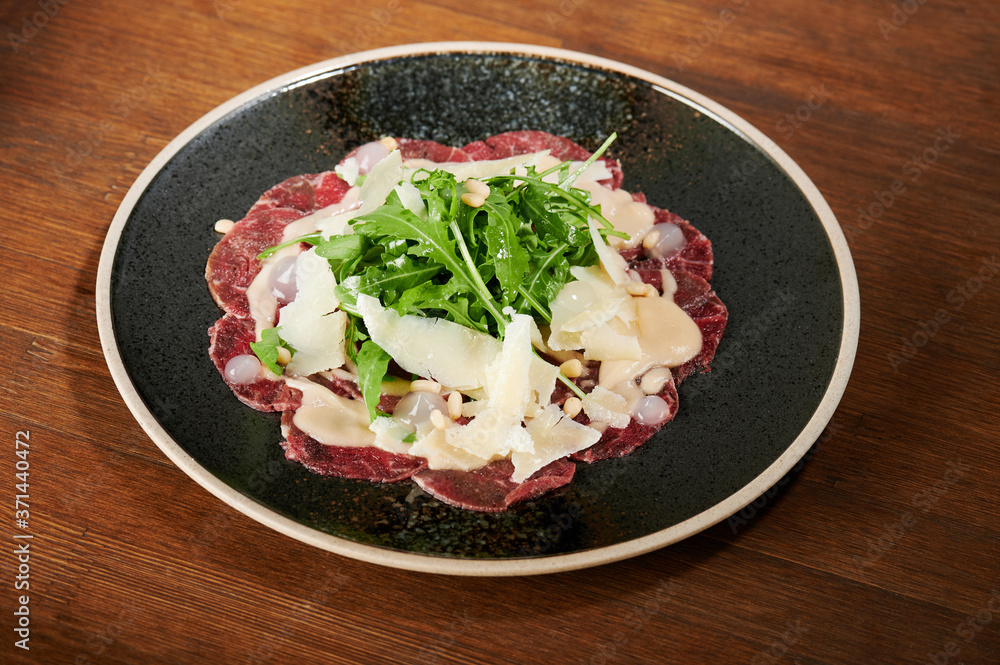 Meat carpaccio with salad