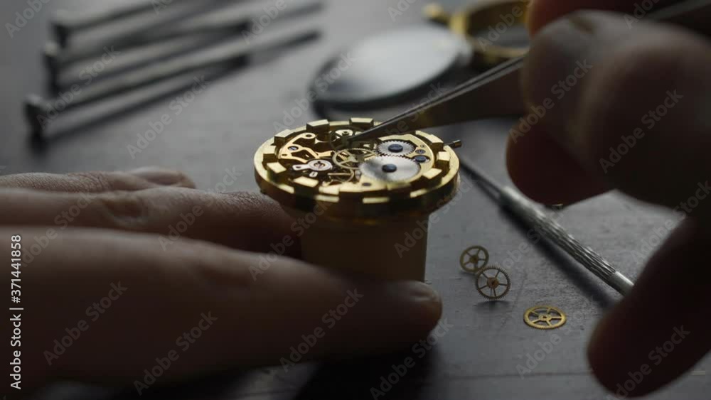 Watchmaker is repearing mechanical wrist watch Watchmaker is repearing mechanical wrist watch