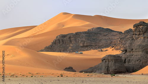 SAFARI ACROSS DESERT DUNES IN TADRART NATIONAL PARK IN ALGERIA. TIN MERZOUGA SAND DUNES. 