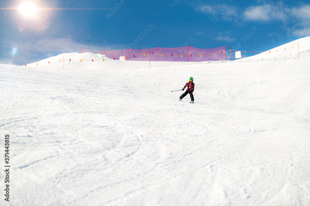 Boy skiing in the mountains